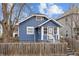 Blue house with wooden fence and yard at 2814 Brookside Ave, Indianapolis, IN 46218