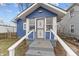 Charming blue bungalow with front porch and steps at 2814 Brookside Ave, Indianapolis, IN 46218