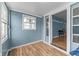 Bright sunroom with wood floors and view to dining area at 2814 Brookside Ave, Indianapolis, IN 46218