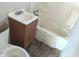 Bathroom with old fixtures and damaged walls and flooring at 2925 Stuart St, Indianapolis, IN 46218