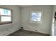Small bedroom with damaged walls and flooring needing repair at 2925 Stuart St, Indianapolis, IN 46218
