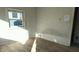 Small bedroom with damaged walls and flooring at 2925 Stuart St, Indianapolis, IN 46218