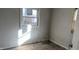 Small bedroom with damaged walls and flooring needing repair at 2925 Stuart St, Indianapolis, IN 46218
