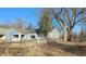 Ranch style home with a gray exterior and a fenced yard at 2925 Stuart St, Indianapolis, IN 46218