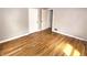 Simple bedroom with hardwood floors, neutral walls, and natural light, offering a blank canvas for personalization at 3513 N Layman Ave, Indianapolis, IN 46218