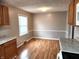 Cozy dining area adjacent to the kitchen, featuring a window for natural light and neutral wall colors at 3513 N Layman Ave, Indianapolis, IN 46218