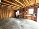Spacious garage interior with wooden shelves and pegboard for organized storage at 3513 N Layman Ave, Indianapolis, IN 46218