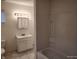Bathroom featuring a vanity, medicine cabinet, and bathtub with shower at 3619 N Hawthorne Ln, Indianapolis, IN 46218