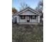 Charming single-story home featuring a covered front porch with classic black accents and a well-maintained lawn at 3619 N Hawthorne Ln, Indianapolis, IN 46218