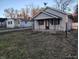 Picture of the house with a porch and well kept yard. Perfect for families or individuals at 3619 N Hawthorne Ln, Indianapolis, IN 46218