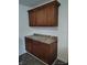 Kitchen area showcases wooden cabinets with laminate countertops and tiled floors for a functional cooking space at 3619 N Hawthorne Ln, Indianapolis, IN 46218