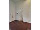 Inviting open room with hardwood floors, clean white walls, and multiple doorway entry points; ideal for versatile living at 3619 N Hawthorne Ln, Indianapolis, IN 46218