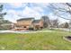 Large backyard with a deck, landscaping, and shed at 4549 Pepper Ct, Indianapolis, IN 46237