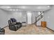 Finished basement featuring a recliner, side table, and carpeted floor at 4549 Pepper Ct, Indianapolis, IN 46237