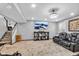 Finished basement with a large TV, seating area, and carpeted floors at 4549 Pepper Ct, Indianapolis, IN 46237