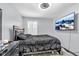 Bright bedroom featuring a comfy bed and wall-mounted TV at 4549 Pepper Ct, Indianapolis, IN 46237