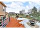 Spacious deck with fire pit and blue railings, some snow present at 4549 Pepper Ct, Indianapolis, IN 46237