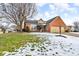 Brick ranch home with attached two-car garage and snowy lawn at 4549 Pepper Ct, Indianapolis, IN 46237