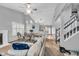 Open concept living and dining area with hardwood floors and staircase at 4549 Pepper Ct, Indianapolis, IN 46237