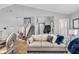 Light and airy living room with a comfortable couch and access to the stairs at 4549 Pepper Ct, Indianapolis, IN 46237