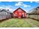 Expansive backyard with a wooden deck, grill, and lush lawn, ideal for outdoor gatherings at 4616 Carrollton Ave, Indianapolis, IN 46205