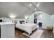 Bedroom with sloped ceilings, wood-look floors, and a walk-in closet at 4616 Carrollton Ave, Indianapolis, IN 46205