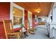 Inviting porch featuring rocking chairs, a wooden ceiling, and access to the front door at 4616 Carrollton Ave, Indianapolis, IN 46205