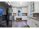 Well-lit kitchen with white cabinets, stainless steel appliances, and wood countertops at 4616 Carrollton Ave, Indianapolis, IN 46205