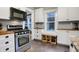 Bright kitchen featuring stainless steel appliances, wood counters, and ample cabinet space at 4616 Carrollton Ave, Indianapolis, IN 46205