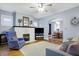 Bright living room features a white brick fireplace, wood floors, and an archway at 4616 Carrollton Ave, Indianapolis, IN 46205