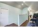 Bright and open office space with wood-look floors and light green walls at 4616 Carrollton Ave, Indianapolis, IN 46205