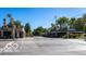 Street view of local businesses under a bright blue sky at 4616 Carrollton Ave, Indianapolis, IN 46205