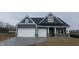Charming single-Gathering home with a two-car garage, covered entry, and stylish gray siding at 4976 Elaine Ct, Noblesville, IN 46062