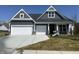 Charming two-car garage home with gray siding, white trim, and manicured front lawn at 4976 Elaine Ct, Noblesville, IN 46062