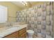 Clean bathroom with shower/tub combo and granite vanity at 5437 Basin Park Dr, Indianapolis, IN 46239