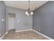 Bright dining area with tile flooring and a chandelier at 5437 Basin Park Dr, Indianapolis, IN 46239