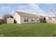 Tan house exterior with shed and grassy backyard at 5437 Basin Park Dr, Indianapolis, IN 46239