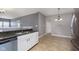 Modern kitchen with stainless steel appliances and granite countertops at 5437 Basin Park Dr, Indianapolis, IN 46239