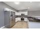 Modern kitchen with stainless steel appliances and granite countertops at 5437 Basin Park Dr, Indianapolis, IN 46239