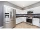 Modern kitchen with stainless steel appliances and granite countertops at 5437 Basin Park Dr, Indianapolis, IN 46239
