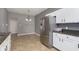 Modern kitchen features stainless steel appliances and granite countertops at 5437 Basin Park Dr, Indianapolis, IN 46239