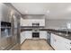 Modern kitchen with stainless steel appliances and granite countertops at 5437 Basin Park Dr, Indianapolis, IN 46239