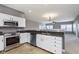 Modern kitchen with stainless steel appliances and granite countertops at 5437 Basin Park Dr, Indianapolis, IN 46239