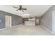 Open living room with kitchen views and neutral-colored walls at 5437 Basin Park Dr, Indianapolis, IN 46239