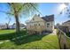 View of the backyard featuring a cozy wooden deck and well-maintained grassy area at 550 Trowbridge St, Indianapolis, IN 46203