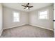 Bright bedroom with a ceiling fan, neutral paint, and carpeted floors at 550 Trowbridge St, Indianapolis, IN 46203