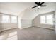Bedroom with angled ceilings, natural light from dual windows, and carpeted floor at 550 Trowbridge St, Indianapolis, IN 46203