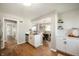 Bright, open kitchen featuring white cabinets, stainless steel appliances, and views into the dining area at 550 Trowbridge St, Indianapolis, IN 46203