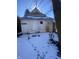 Distressed building in backyard, needs renovation. Snowy ground at , Indianapolis, IN 46202