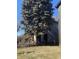 Side view of a neglected home needing significant repairs at , Indianapolis, IN 46202